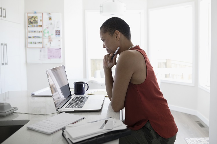 Woman looking at laptop screen